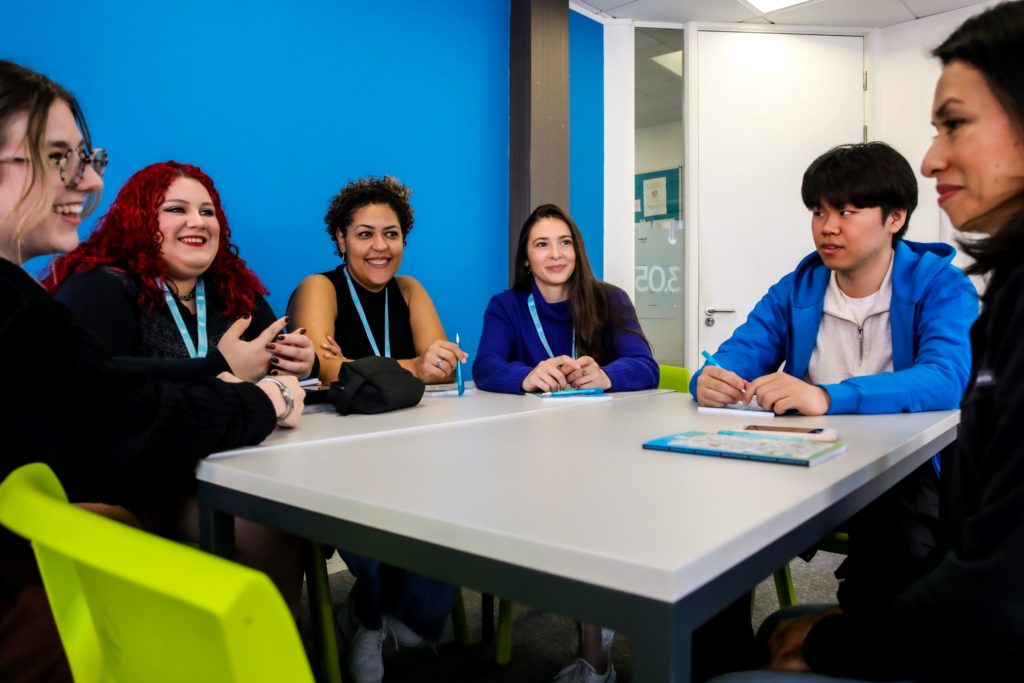 A group of students at Malvern House Manchester studying an IELTS preparation course