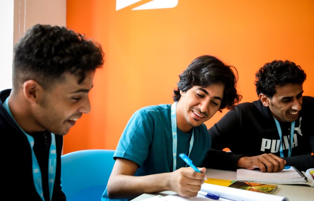 Male students studying a General English course