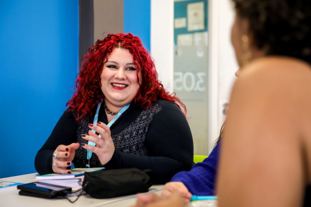 Female student smiling at General English class at Malvern House Manchester