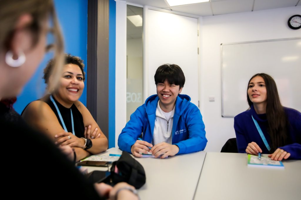 Group of four students in class