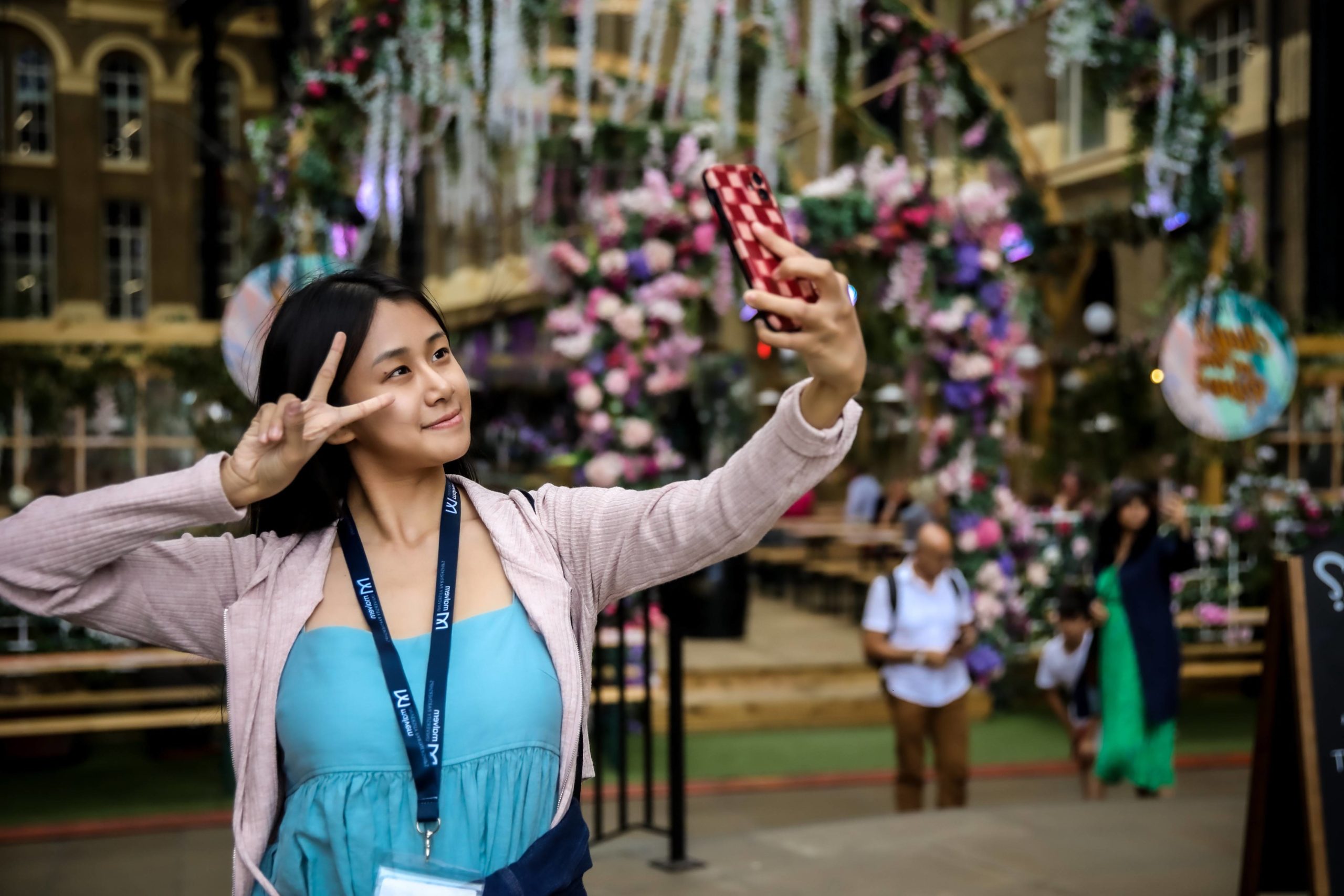 student in covent garden taking a selfie
