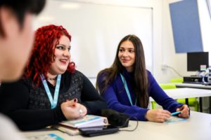 Two female students in class