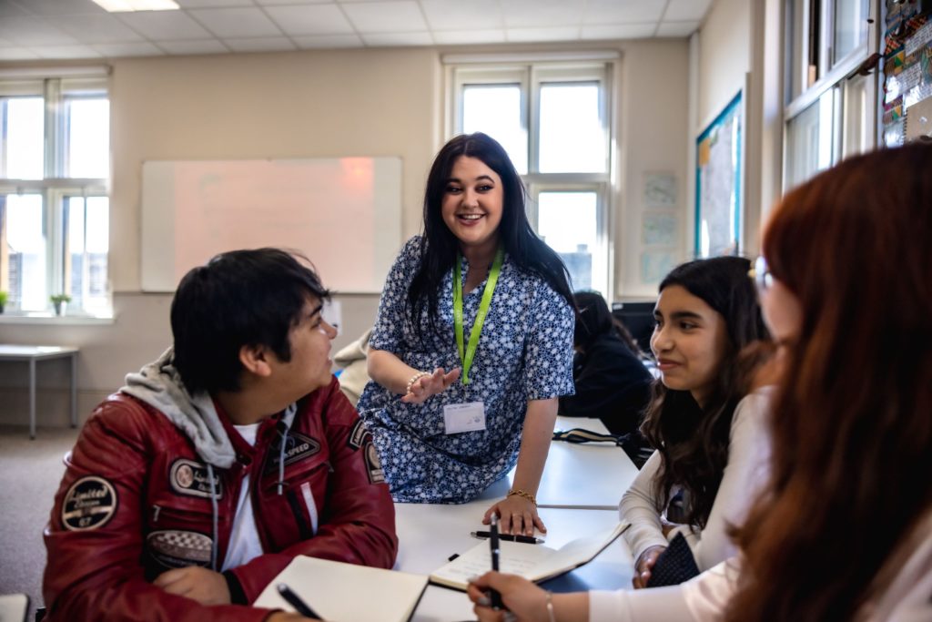 Teacher in classroom with young learners