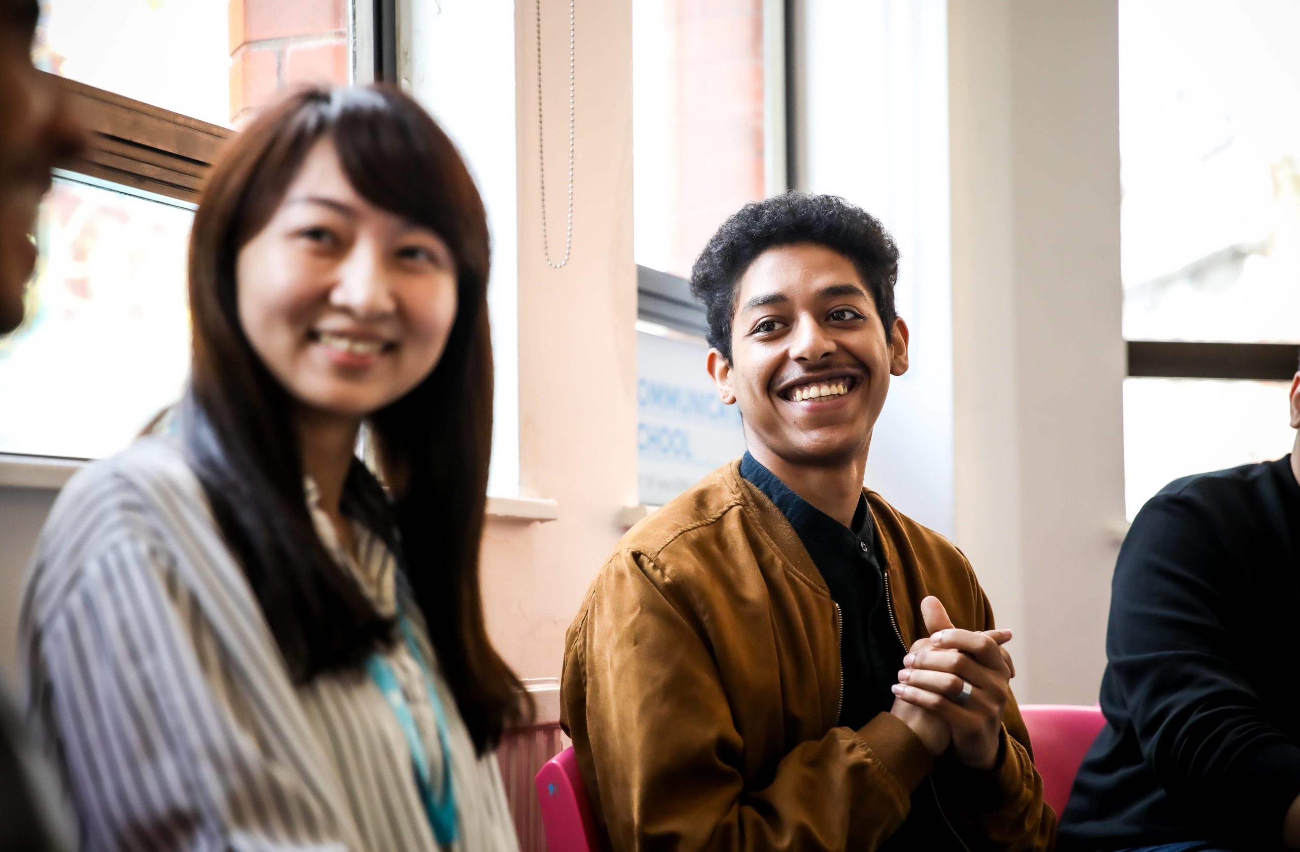 students talking and laughing in Manchester classroom