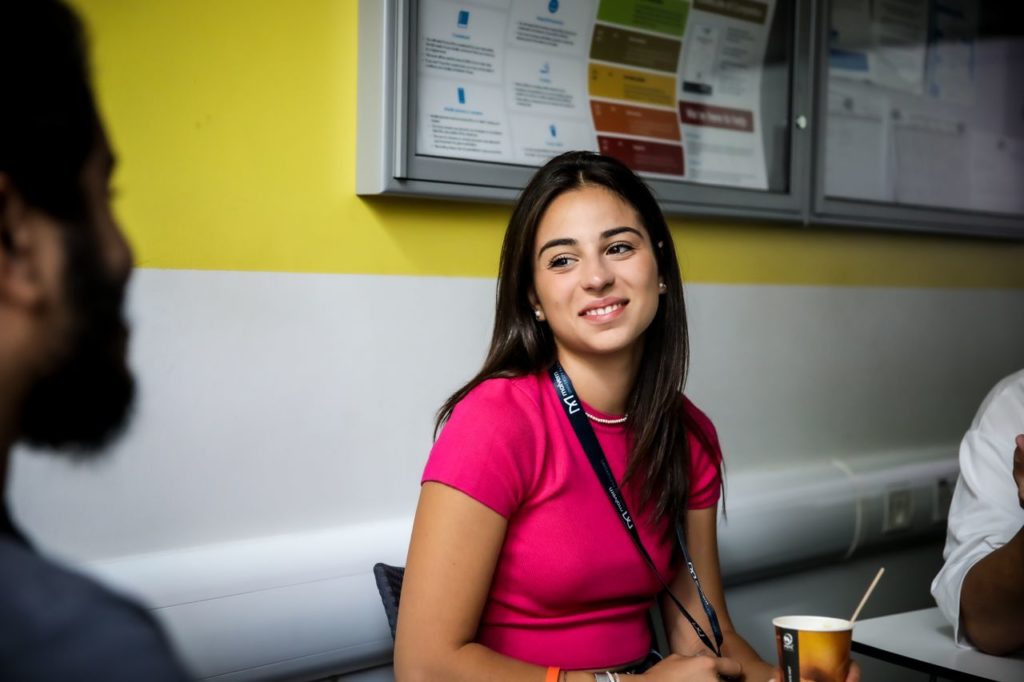 female student smiling in classroom